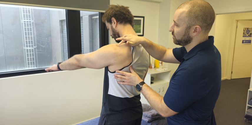 Physiotherapist assessing shoulder pain at Adapt Sports Physiotherapy, Chirnside Park